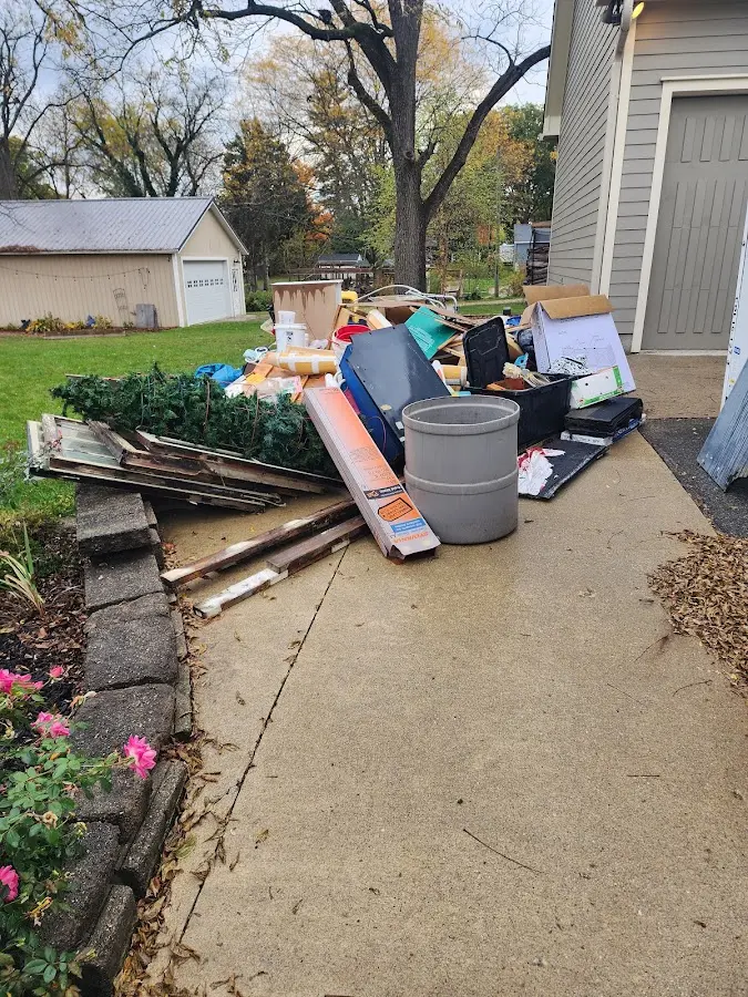 Dumpster being loaded with debris for 3 Yard Dumpster Rental in Leicester